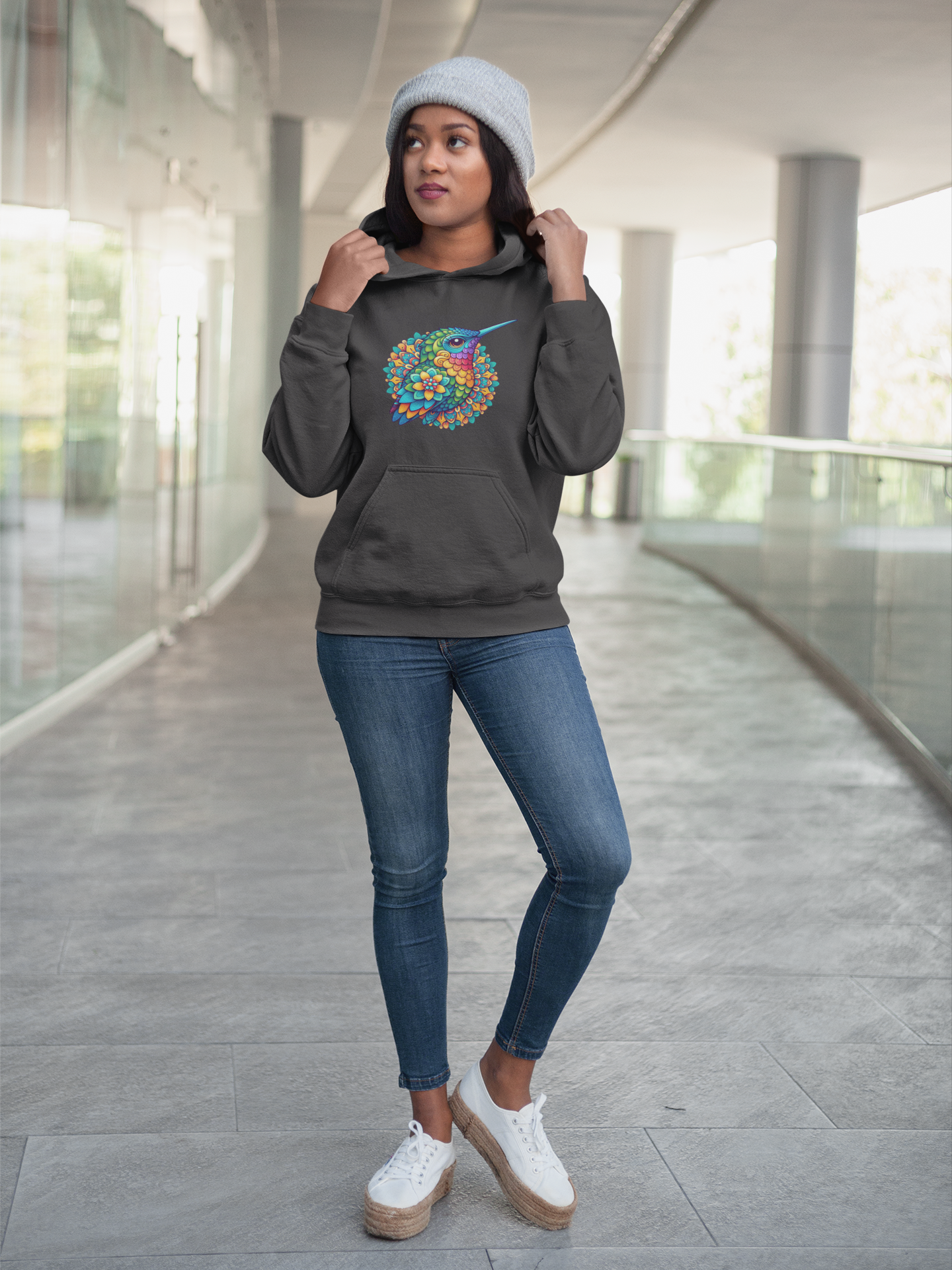 mockup-of-a-young-woman-wearing-a-pullover-hoodie-while-at-a-shopping-center-17747_2.png